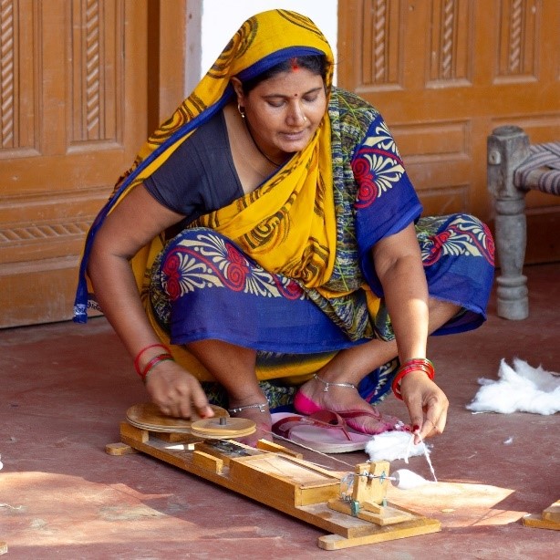 Suneeta spins for the social enterprise SPOKSS in Uttar Pradesh