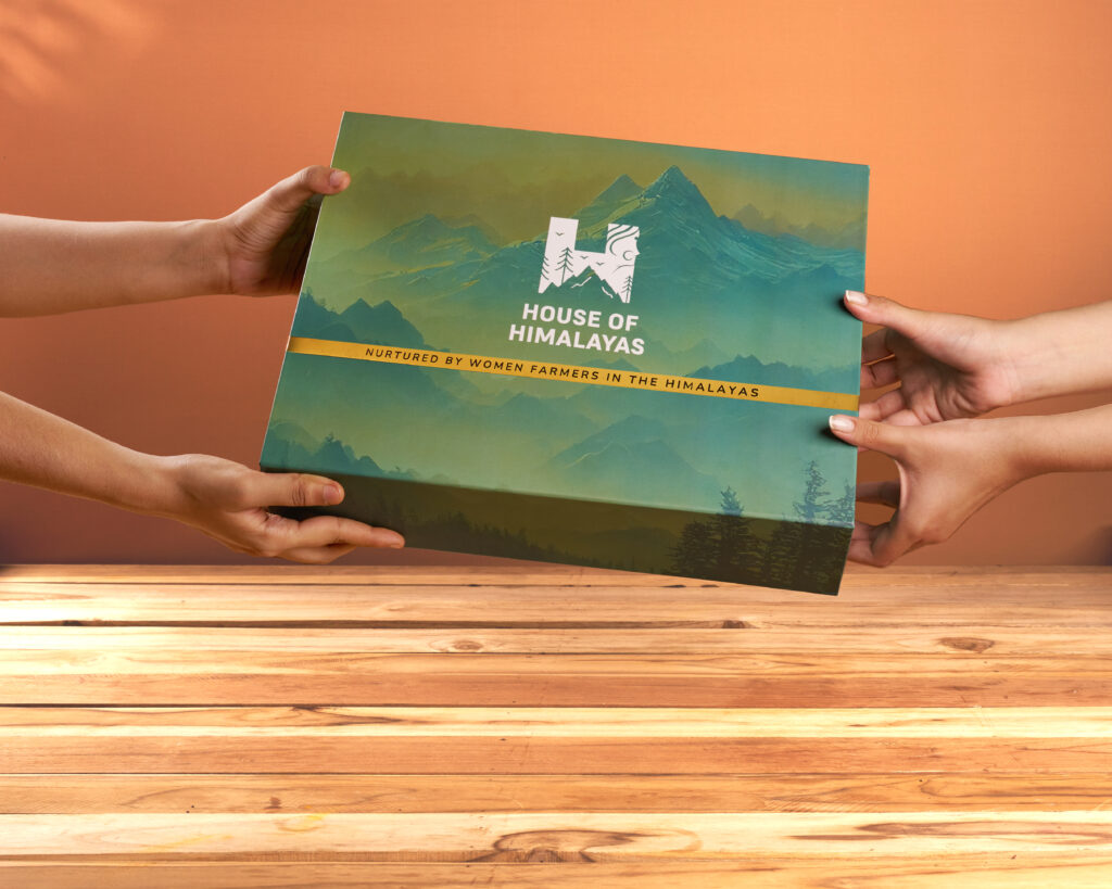 A House of Himalayas gift box being held by two people