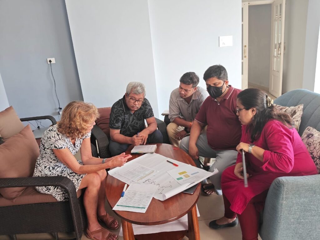 Women on Wings supply chain managment expert and Tamul Plates team discuss the SOPs to use for optimizations