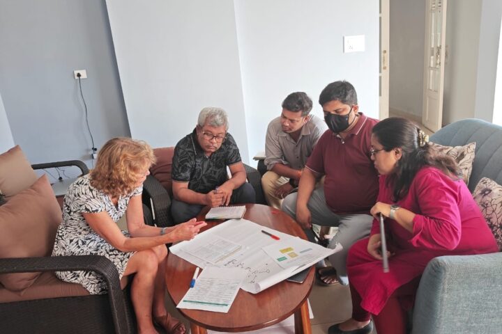 Women on Wings supply chain managment expert and Tamul Plates team discuss the SOPs to use for optimizations